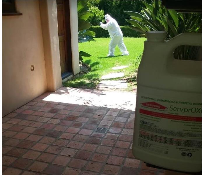 Employee in PPE on the grass